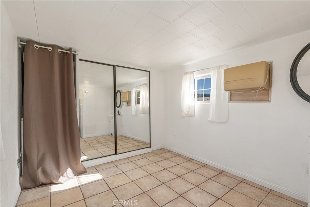 26235 9th Street, Unit 18 Highland, CA 92346 - Photo 13 of 31 a view of a hallway with bathroom
