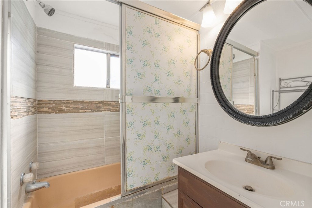 26235 9th Street, Unit 18 Highland, CA 92346 - Photo 15 of 31 a bathroom with a sink and a mirror