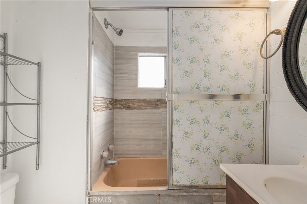 26235 9th Street, Unit 18 Highland, CA 92346 - Photo 16 of 31 a bathroom with a bathtub and shower