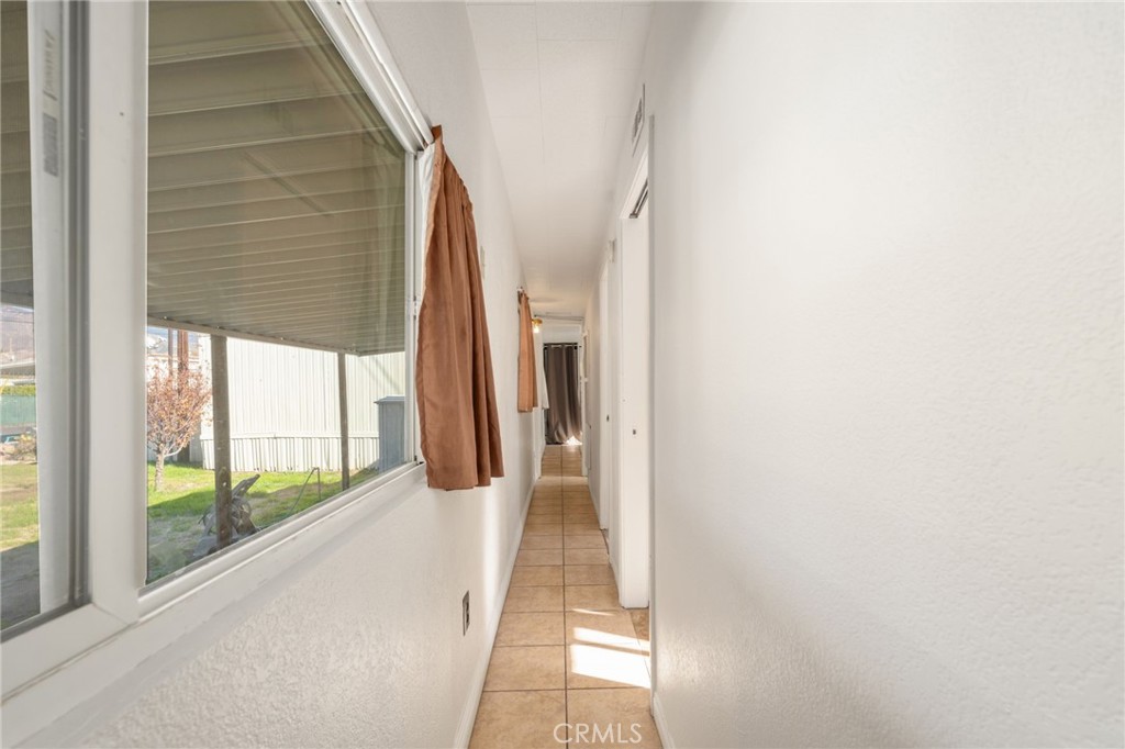 26235 9th Street, Unit 18 Highland, CA 92346 - Photo 19 of 31 a view of a glass door and the balcony
