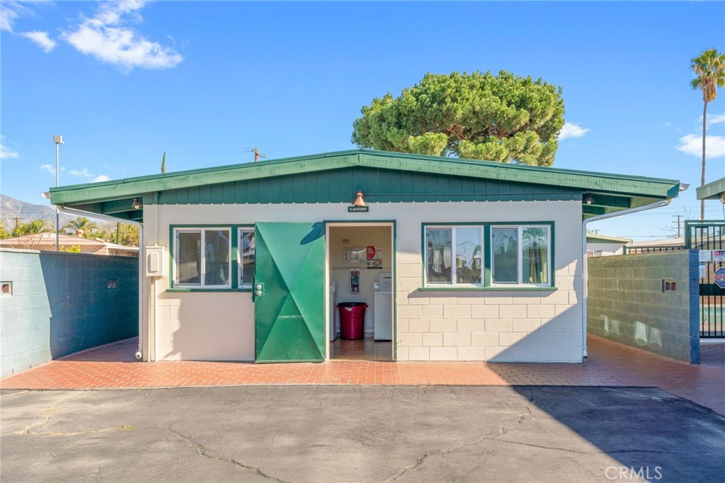 26235 9th Street, Unit 18 Highland, CA 92346 - Photo 20 of 31 a front view of a house with a porch