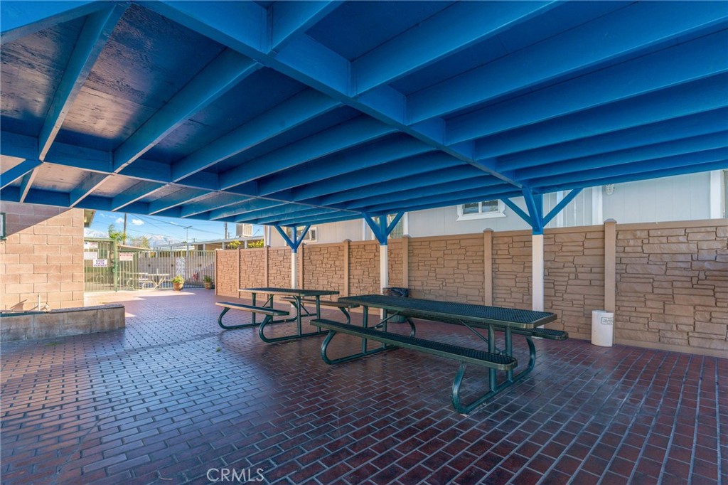 26235 9th Street, Unit 18 Highland, CA 92346 - Photo 23 of 31 a living room with furniture and a wooden floor