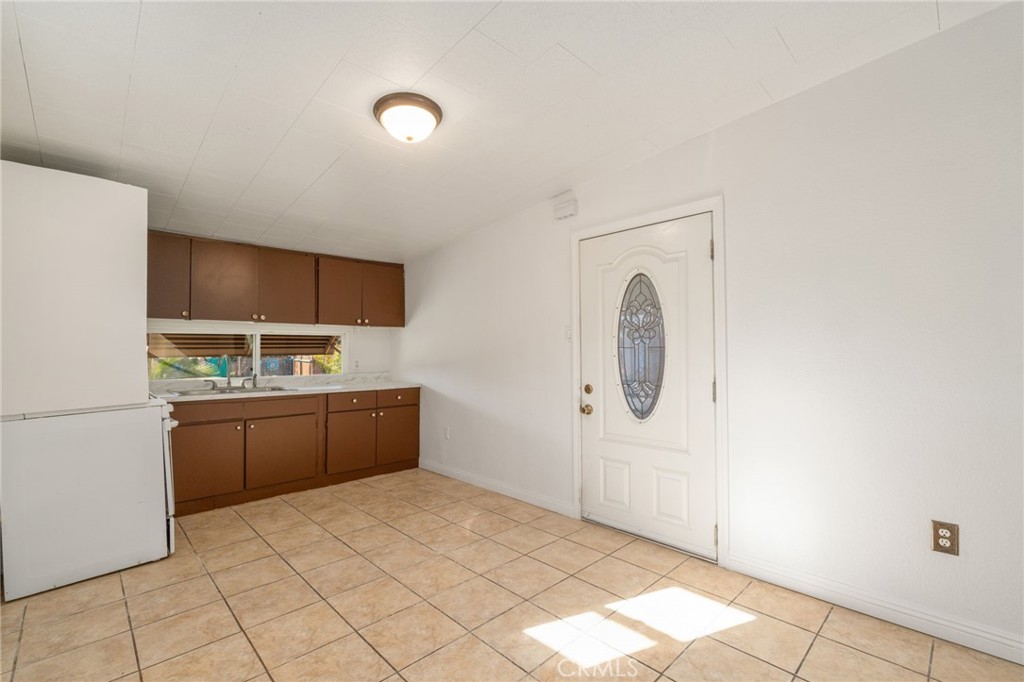 26235 9th Street, Unit 18 Highland, CA 92346 - Photo 4 of 31 a room with a sink and a mirror