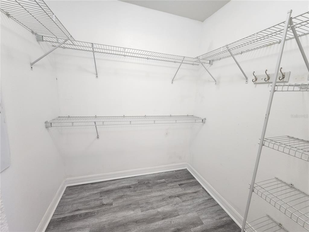 4017 Longworth Loop Kissimmee, FL 34744 - Photo 14 of 22 a view of a room with racks on the wall