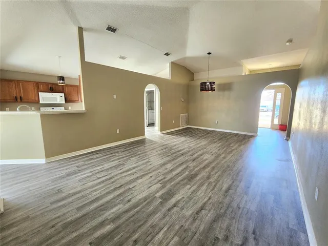 a view of a livingroom with wooden floor