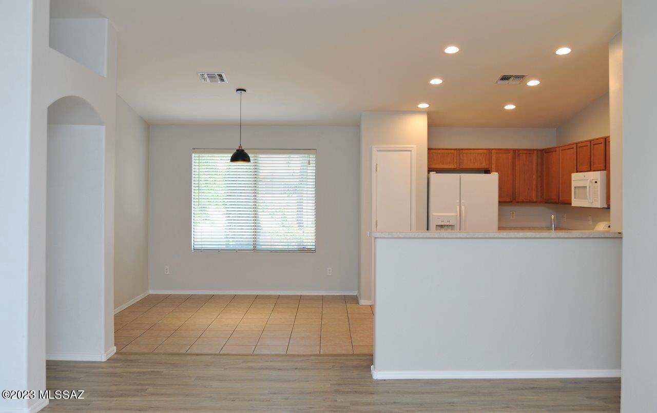 4543 South Valley Road Tucson, AZ 85714 - Photo 12 of 41 a view of kitchen with center island and wooden floor