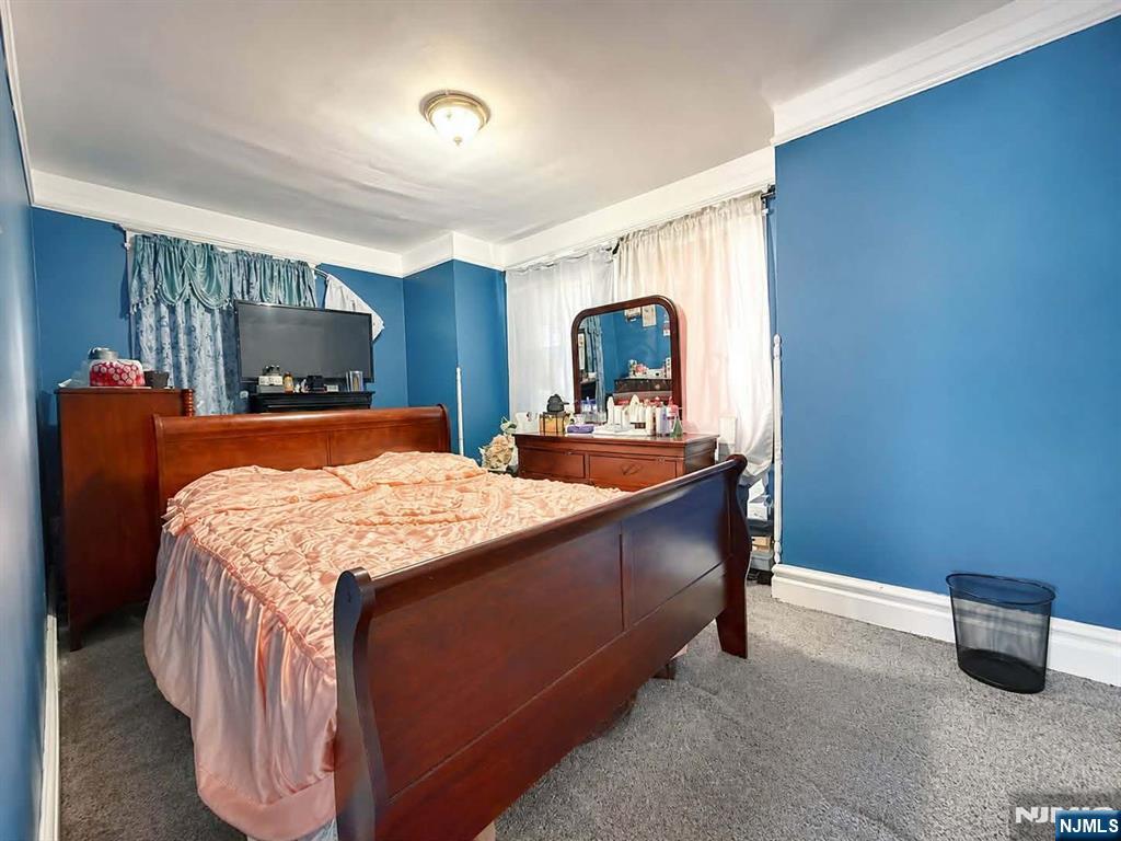 102 State Street Bloomfield, NJ 07003 - Photo 8 of 11 a bed room with a bed and a television