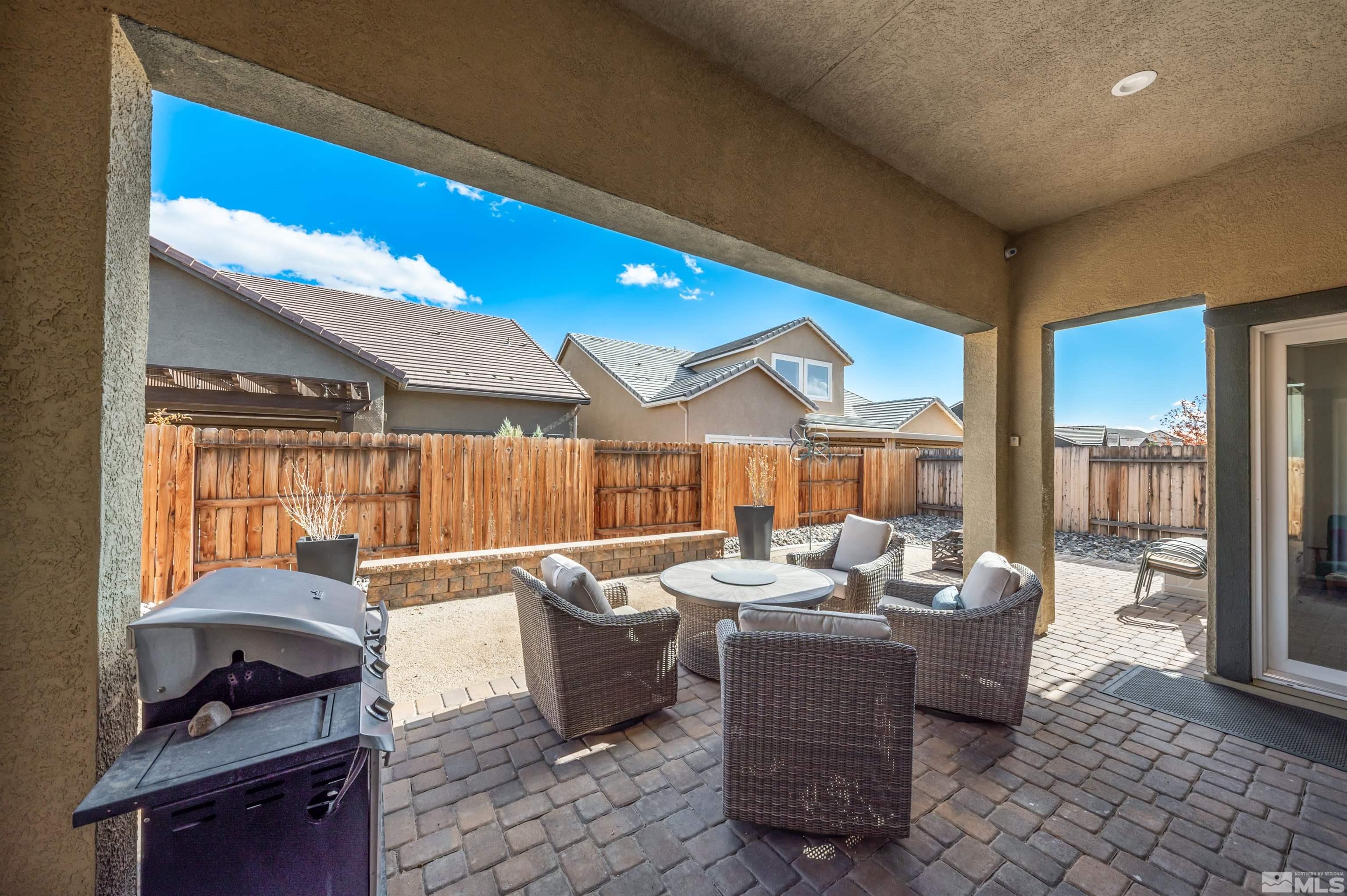 9494 Baldacci Road Reno, NV 89521 - Photo 16 of 34 a living room with furniture a rug and a potted plant