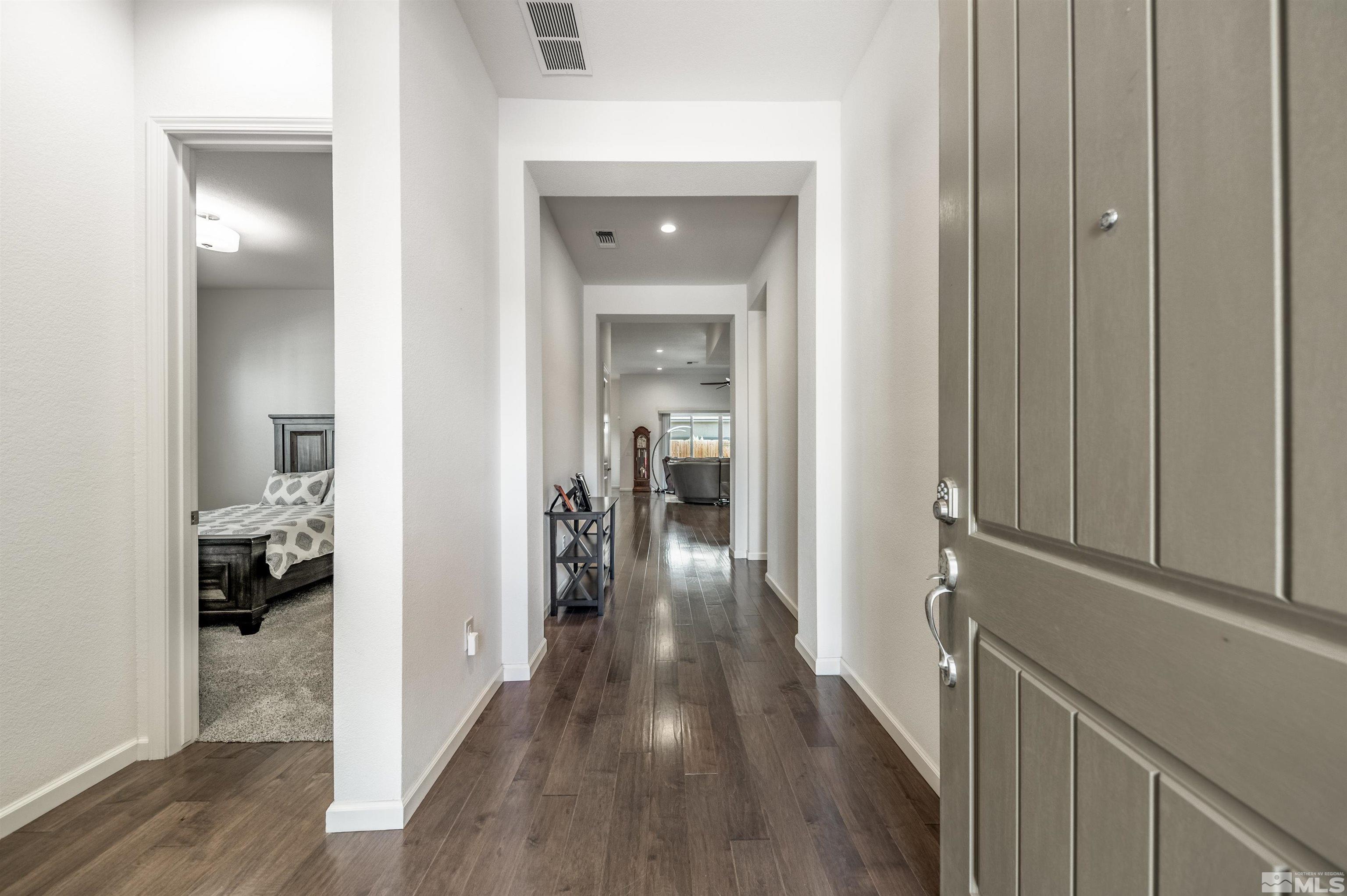 9494 Baldacci Road Reno, NV 89521 - Photo 2 of 34 a view of a hallway with a wooden floors