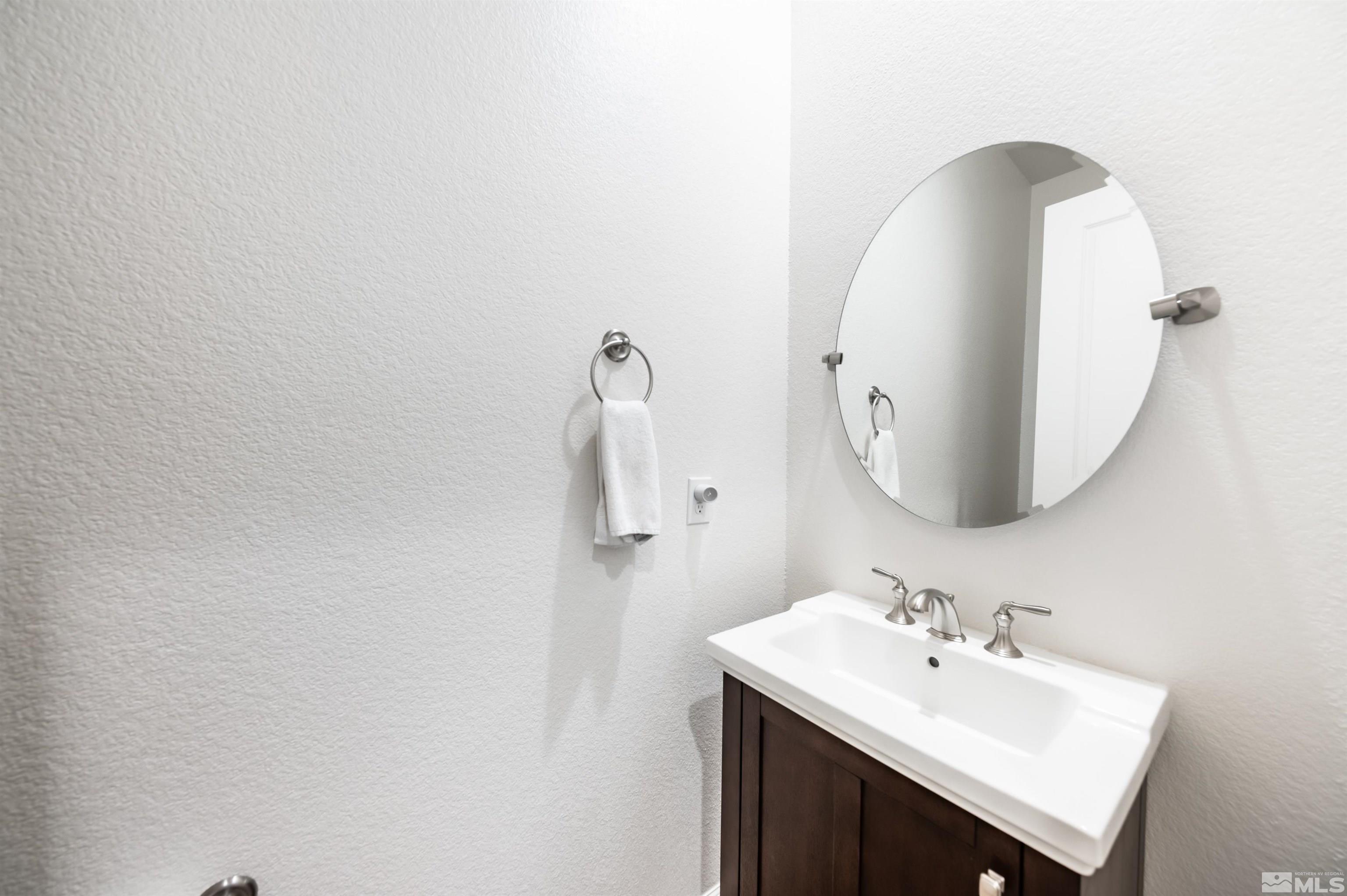 9494 Baldacci Road Reno, NV 89521 - Photo 25 of 34 a bathroom with a sink and a mirror
