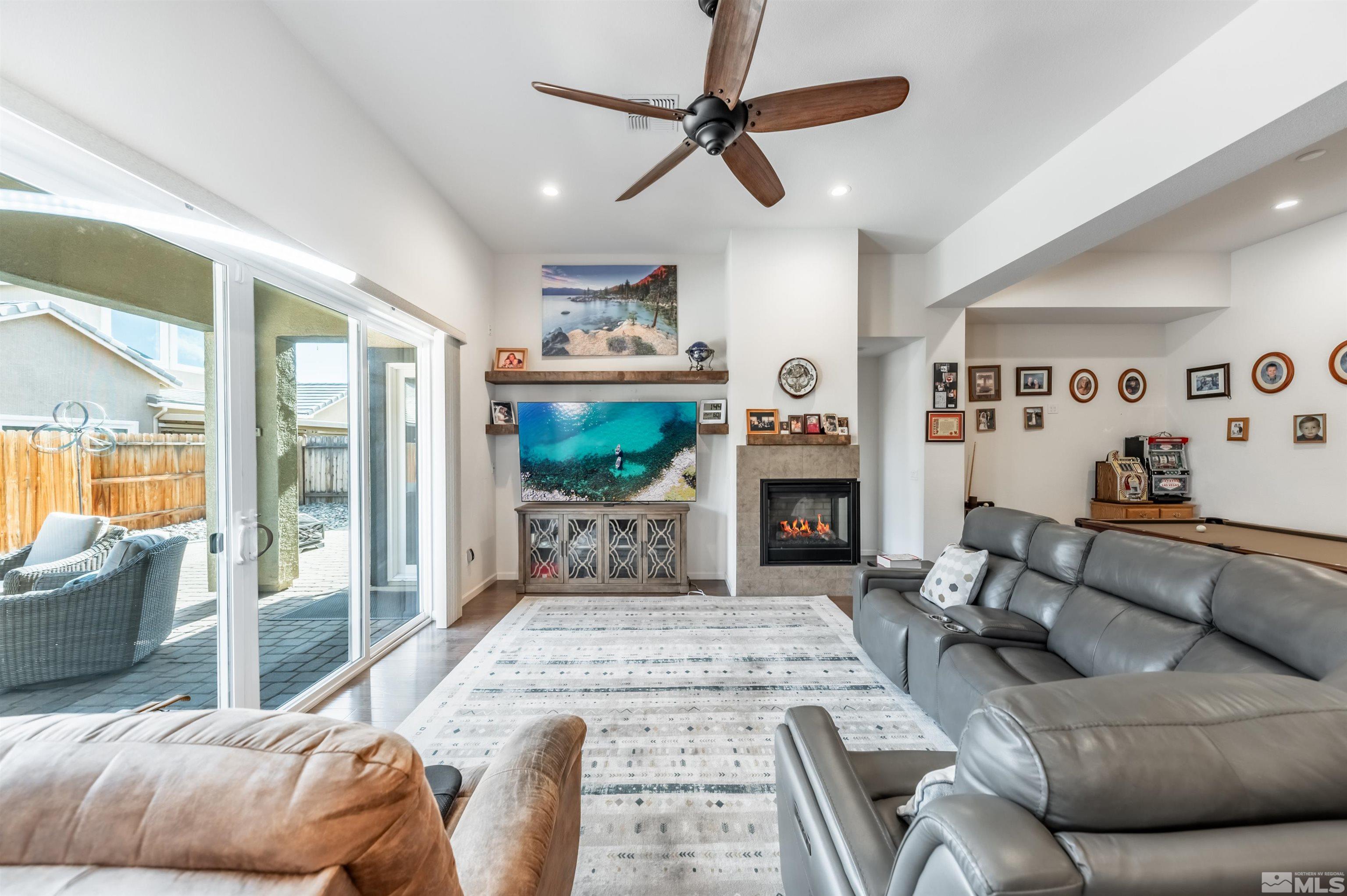 9494 Baldacci Road Reno, NV 89521 - Photo 8 of 34 a living room with furniture and a fireplace