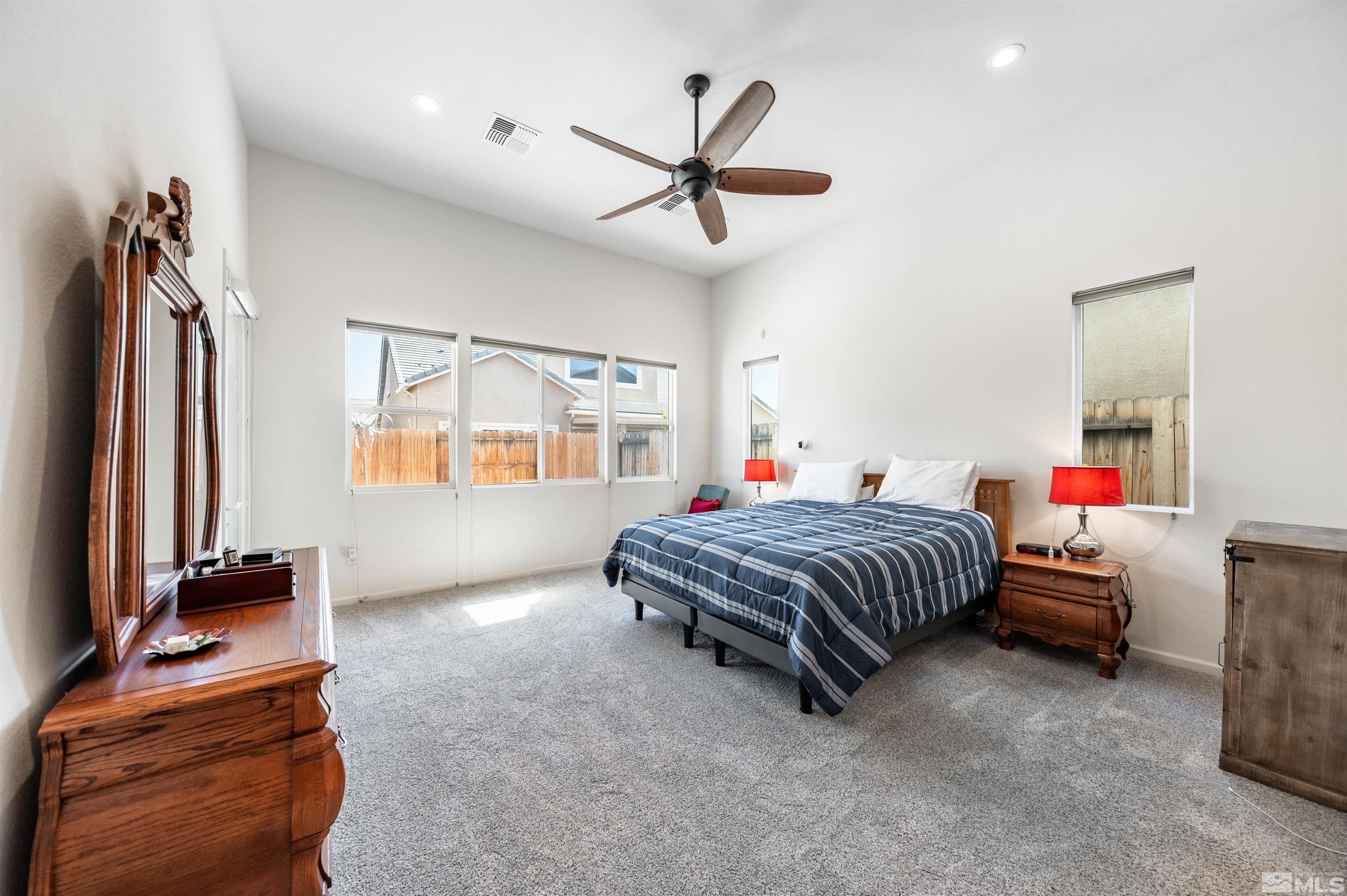 9494 Baldacci Road Reno, NV 89521 - Photo 9 of 34 a bedroom with a bed and a ceiling fan