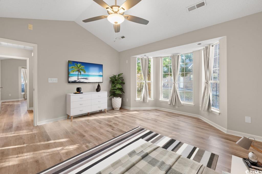 1639 Coventry Road Surfside Beach, SC 29575 - Photo 16 of 38 Unfurnished living room with vaulted ceiling, light hardwood / wood-style floors, and ceiling fan