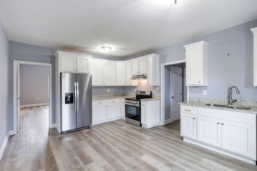 191 Elm Street Trion, GA 30753 - Photo 11 of 25 a kitchen with a refrigerator and a sink