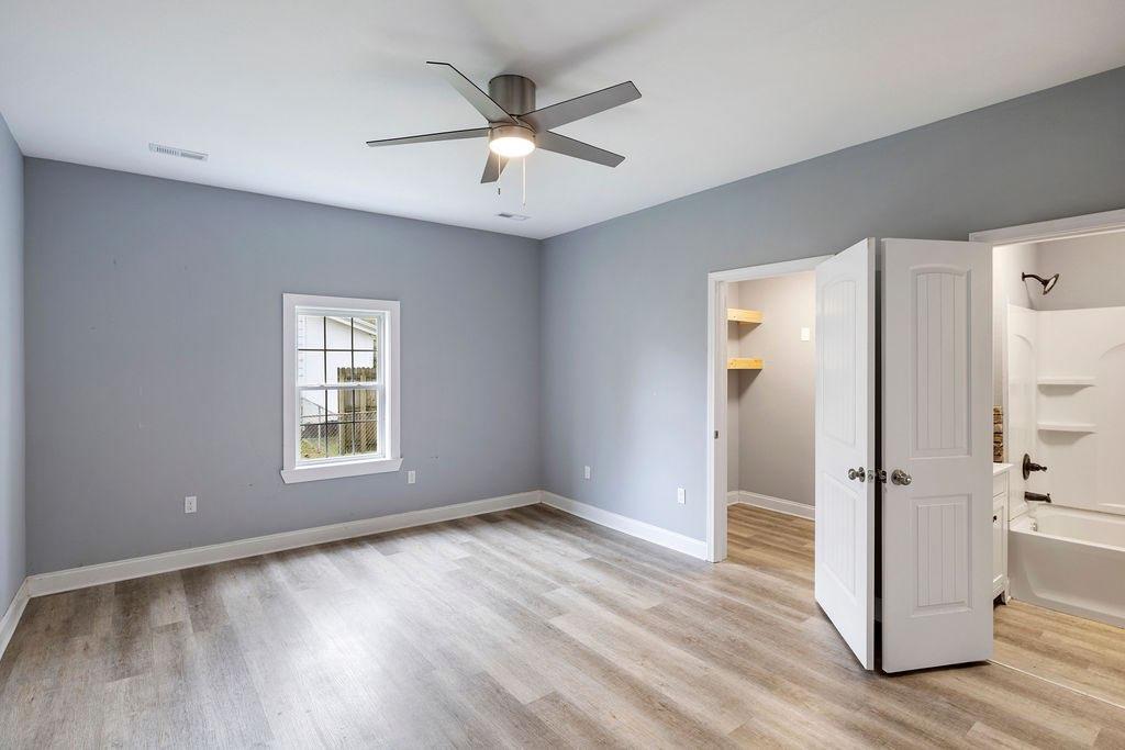 191 Elm Street Trion, GA 30753 - Photo 12 of 25 wooden floor in an empty room with a window