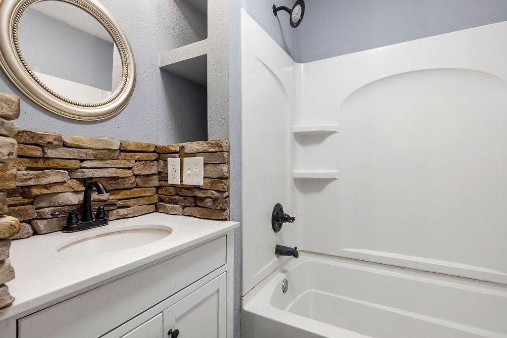 191 Elm Street Trion, GA 30753 - Photo 13 of 25 a bathroom with a sink a toilet and a mirror
