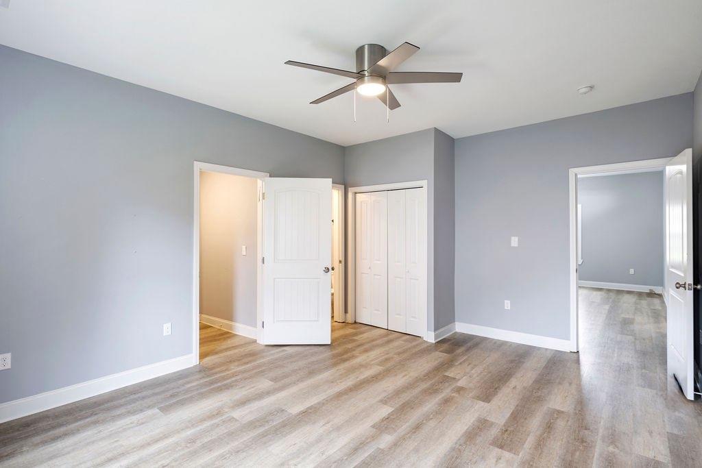 191 Elm Street Trion, GA 30753 - Photo 16 of 25 a view of a livingroom with a ceiling fan & entryway