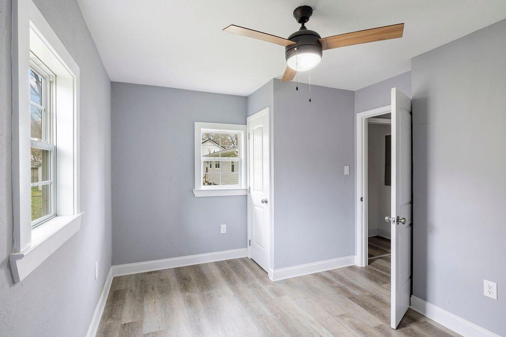 191 Elm Street Trion, GA 30753 - Photo 19 of 25 a view of an empty room with window and wooden floor