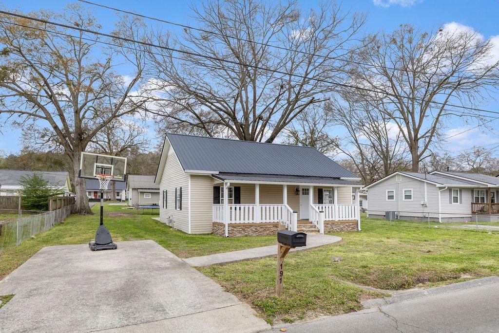 191 Elm Street Trion, GA 30753 - Photo 23 of 25 a front view of a house with garden and trees