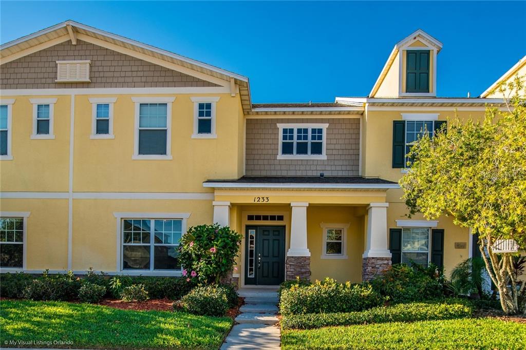 1233 Tallow Road Apopka, FL 32703 - Photo 1 of 1 a front view of a house with garden