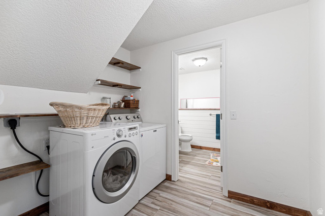 814 Mountain Road Logan, UT 84321 - Photo 29 of 42 Dedicated laundry area featuring a front-loading washer and dryer