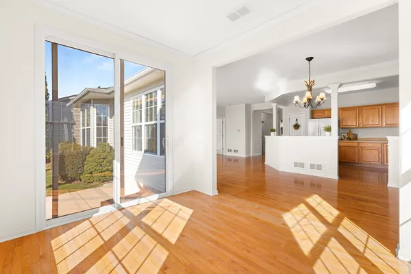 a kitchen with stainless steel appliances granite countertop a refrigerator stove sink and cabinets