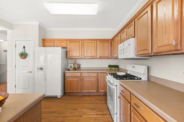 a kitchen with a stove a sink and a refrigerator