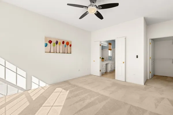 a bathroom with a granite countertop sink a mirror and a shower
