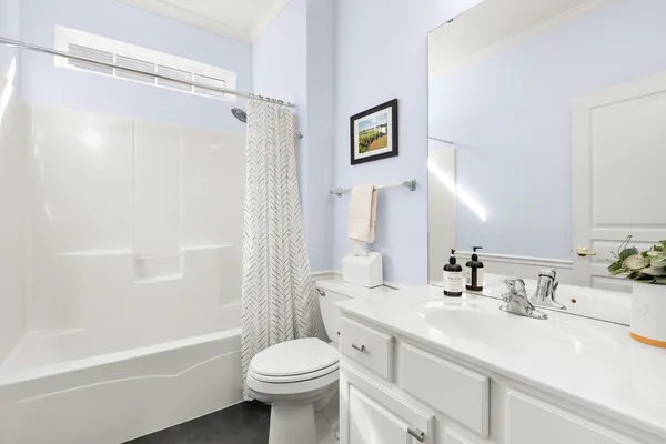 a view of a hallway with wooden floor and entryway