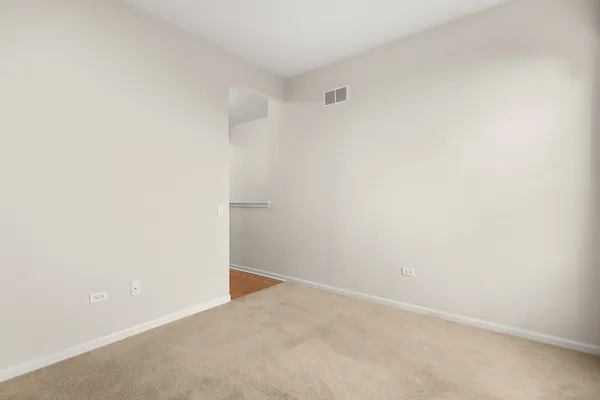 a view of a room with wooden walls