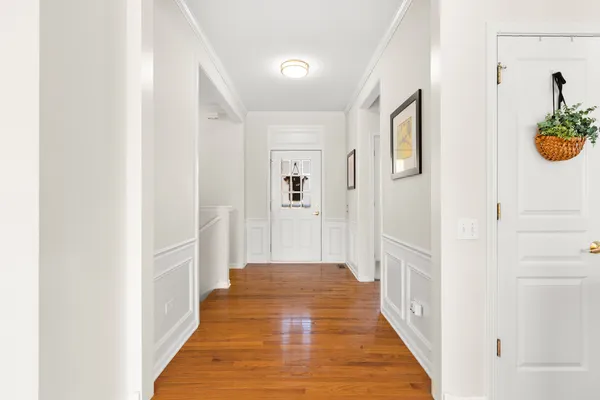 a view of a room with wooden floor