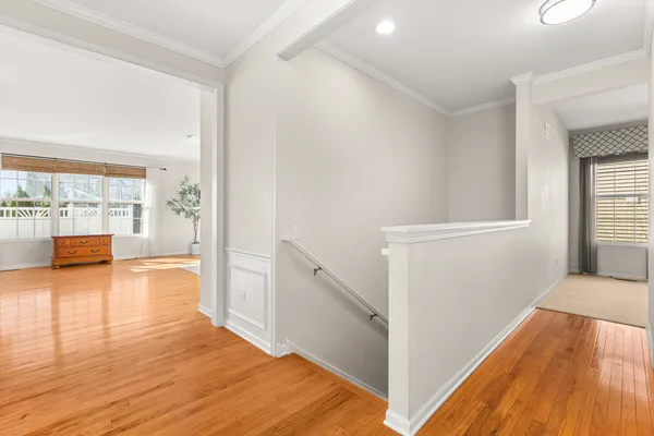 a sign board with buildings in the background