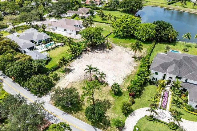 an aerial view of residential house with outdoor space and swimming pool