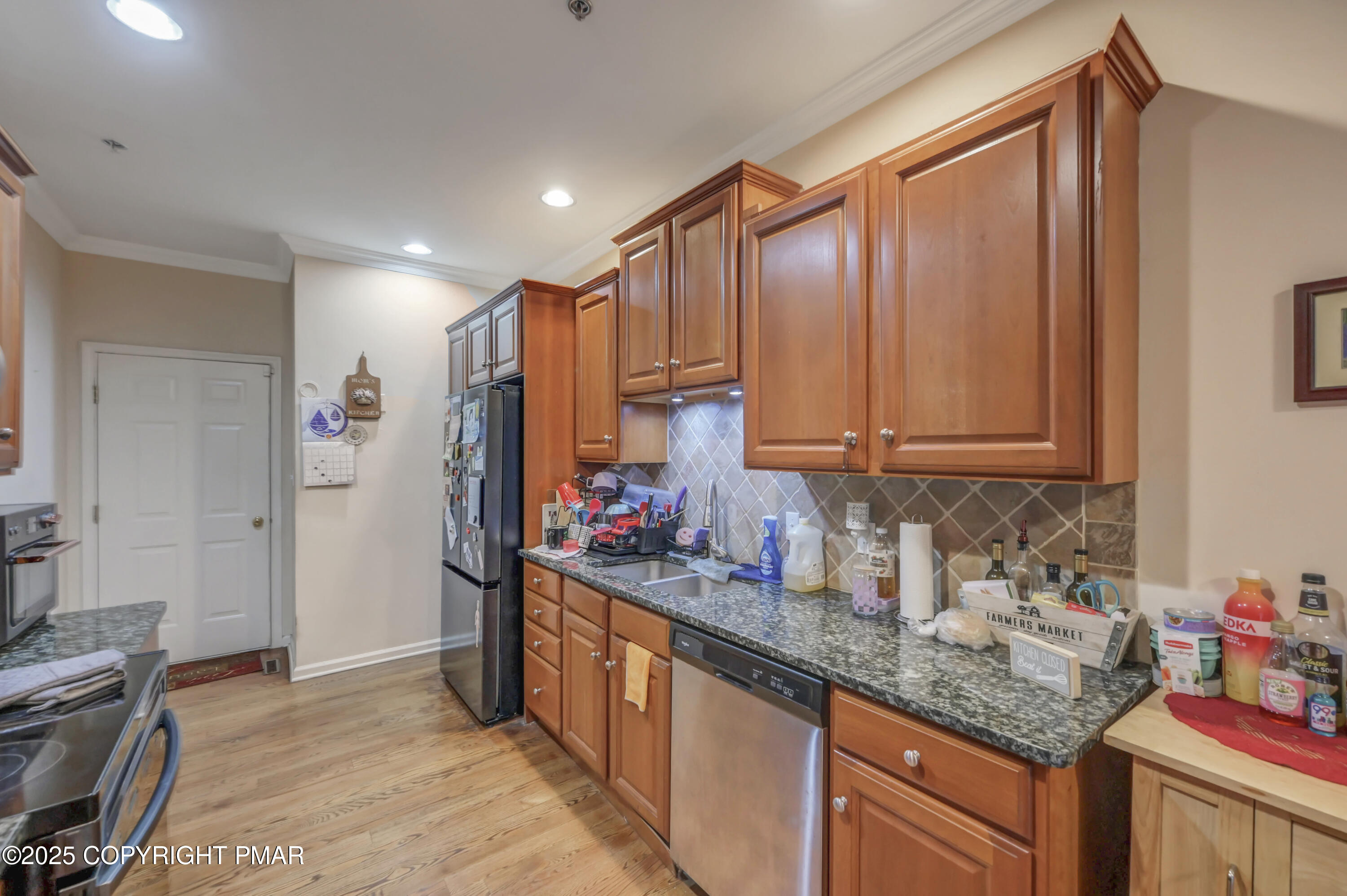 18 Elm Court, Unit UL3 East Stroudsburg, PA 18301 - Photo 18 of 48 a kitchen with stainless steel appliances granite countertop a sink stove and cabinets