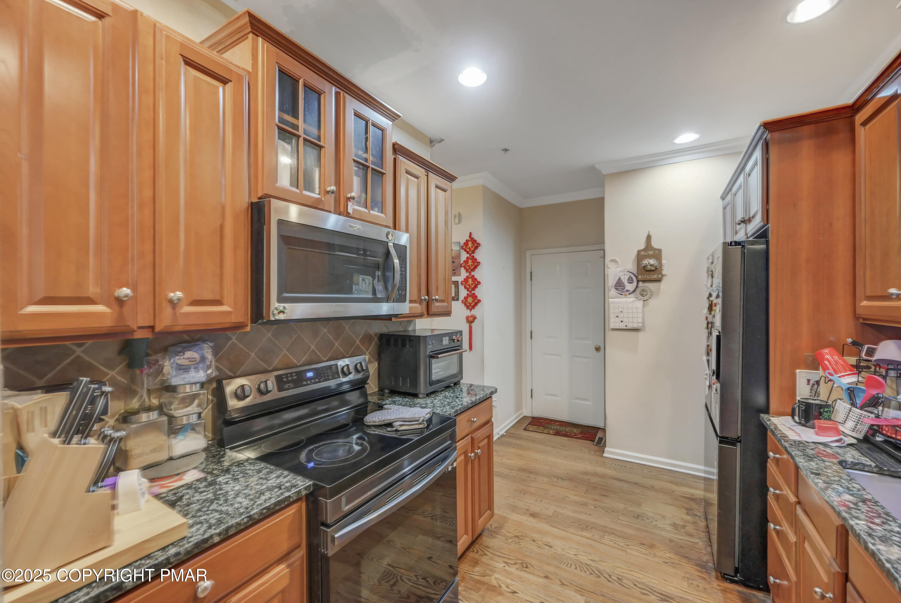 18 Elm Court, Unit UL3 East Stroudsburg, PA 18301 - Photo 20 of 48 a kitchen with stainless steel appliances granite countertop a stove and a refrigerator