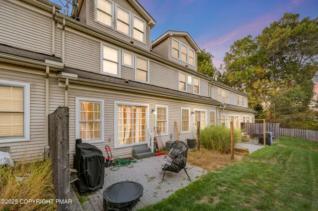 a backyard of a house with seating space