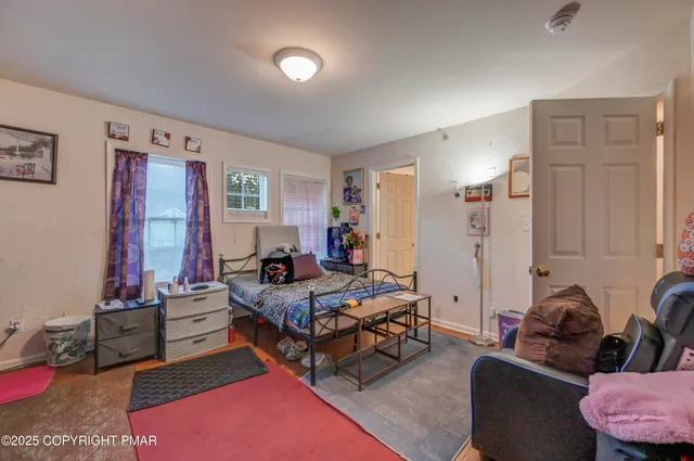 a bedroom with furniture and a couch