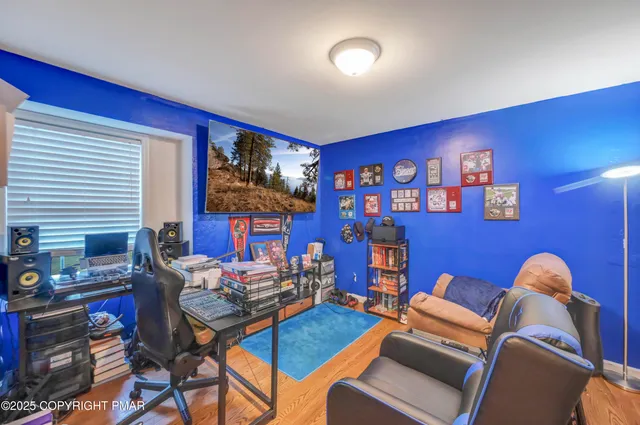 a living room with furniture and a lamp