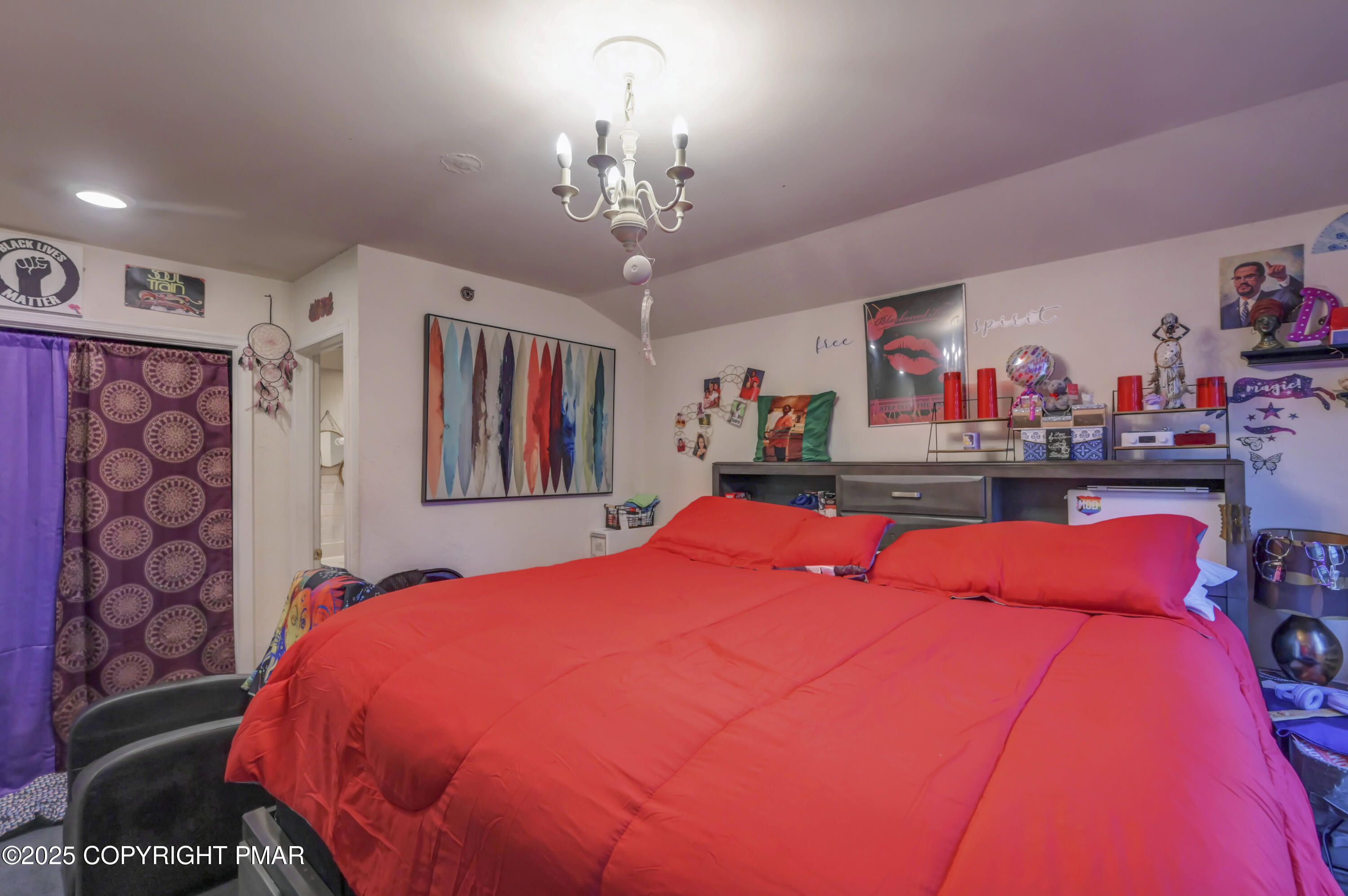 18 Elm Court, Unit UL3 East Stroudsburg, PA 18301 - Photo 39 of 48 a bed room with a bed and a chandelier