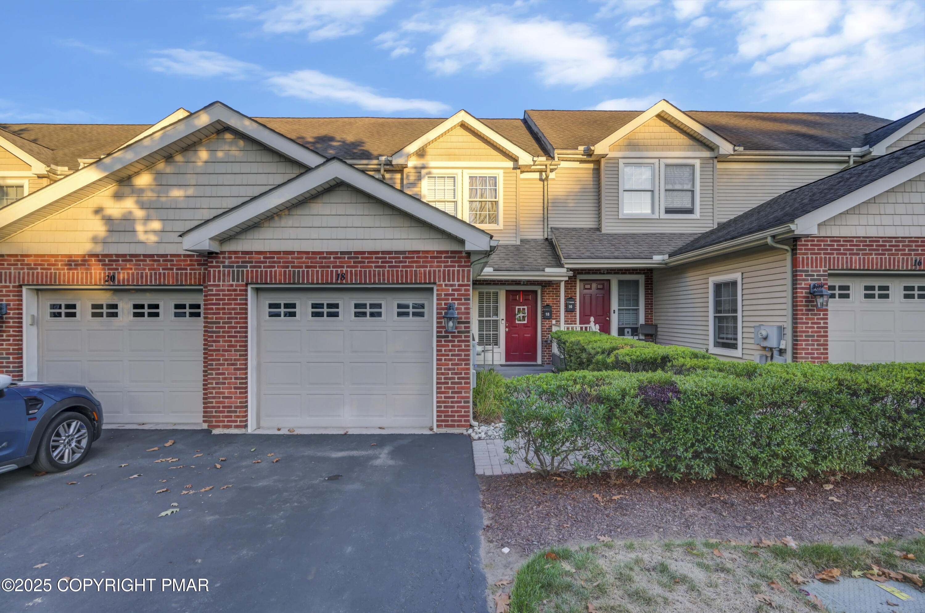 18 Elm Court, Unit UL3 East Stroudsburg, PA 18301 - Photo 4 of 48 a front view of a house with a yard and garage