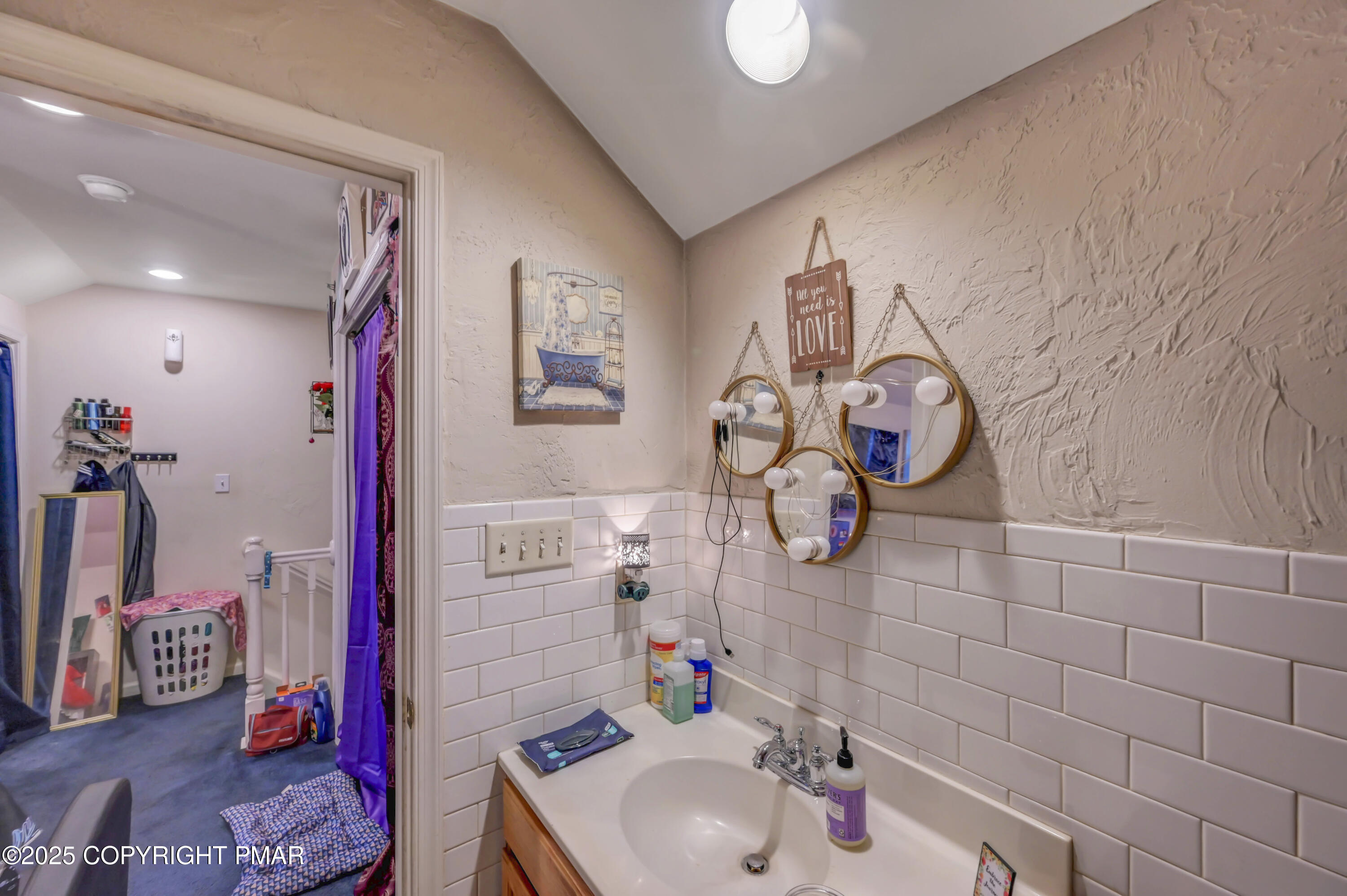 18 Elm Court, Unit UL3 East Stroudsburg, PA 18301 - Photo 42 of 48 a bathroom with a sink vanity mirror and tub