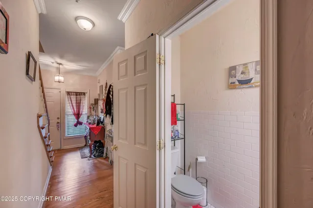 a view of a bathroom with a toilet and a shower