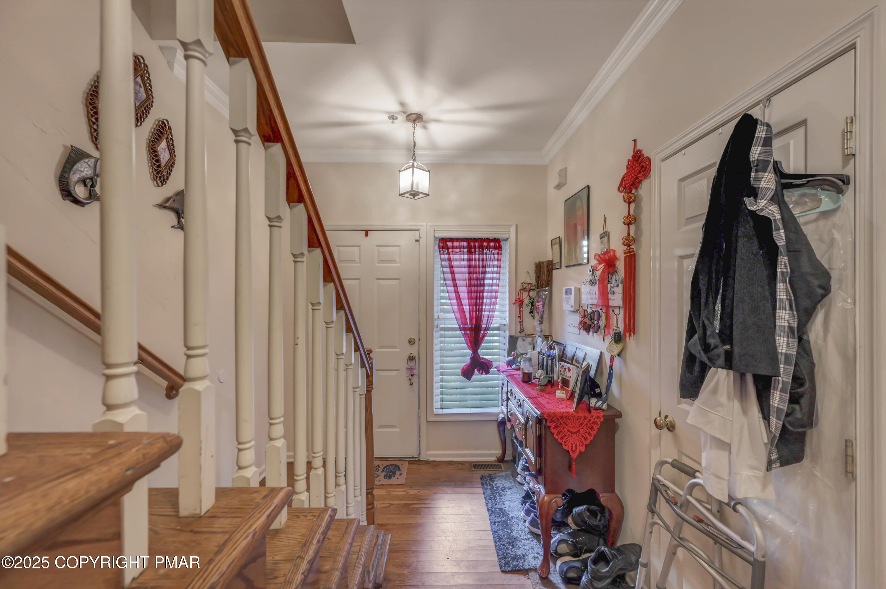 18 Elm Court, Unit UL3 East Stroudsburg, PA 18301 - Photo 7 of 48 a view of a hallway with wooden floor and stairs