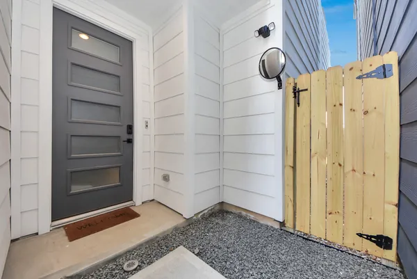 a view of an empty room with fire place