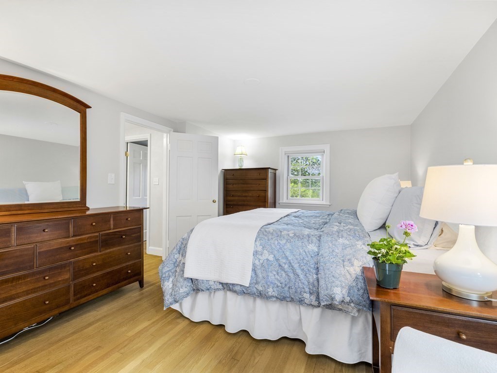 48 Fuller Brook Road Wellesley, MA 02482 - Photo 11 of 16 a bedroom with a bed potted plant and a dresser