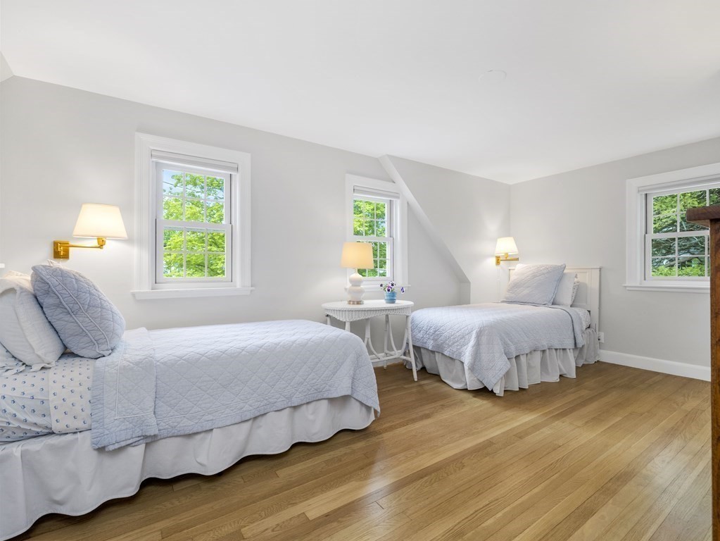 48 Fuller Brook Road Wellesley, MA 02482 - Photo 12 of 16 a bedroom with two beds and painting on the wall