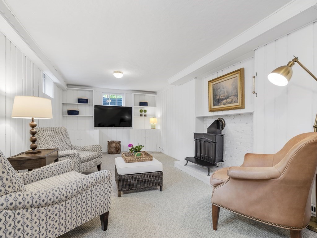 48 Fuller Brook Road Wellesley, MA 02482 - Photo 13 of 16 a living room with furniture and a flat screen tv