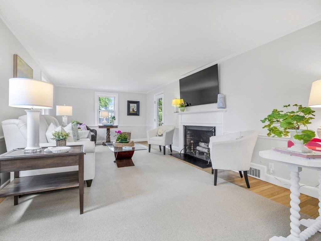 48 Fuller Brook Road Wellesley, MA 02482 - Photo 3 of 16 a living room with furniture and a fireplace