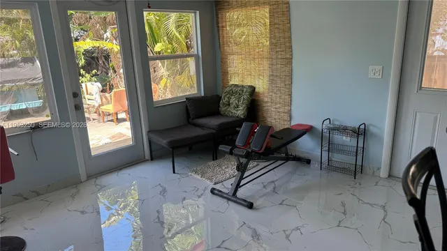 a living room with furniture and a window