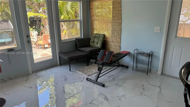 a living room with furniture and a window